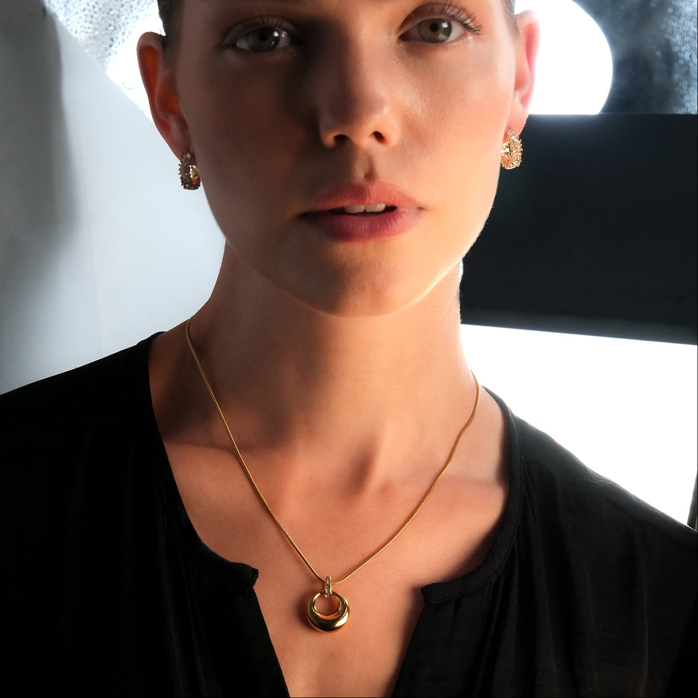 ALBASIMI: Snake Skin Chain with Zirconia (CZ) Embedded Clasp & Asymmetrical Circle Pendent.