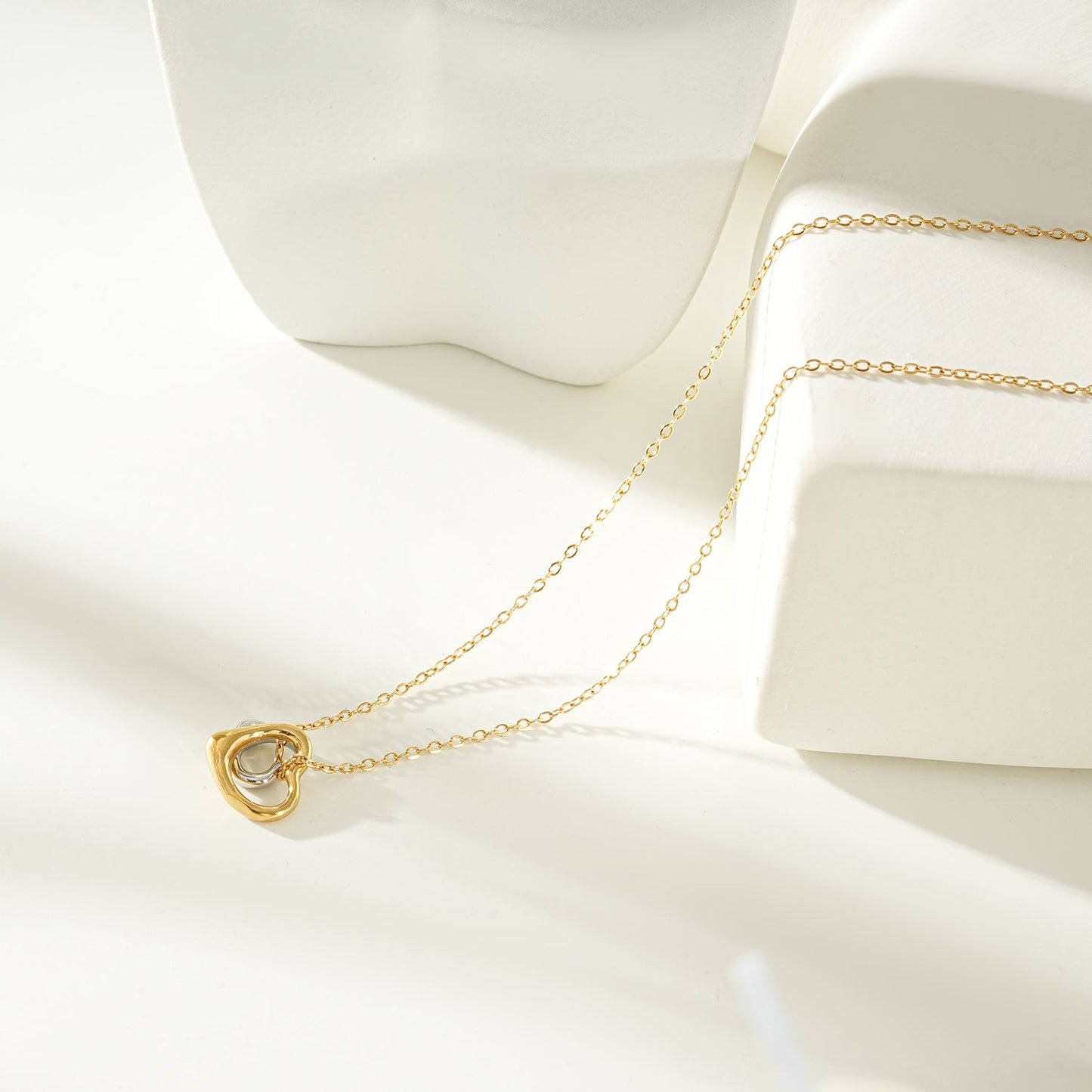 LOLANDA Gold+Silver: Dainty Gold Chain Necklace with Two Abstract Heart Charms in Gold & Silver