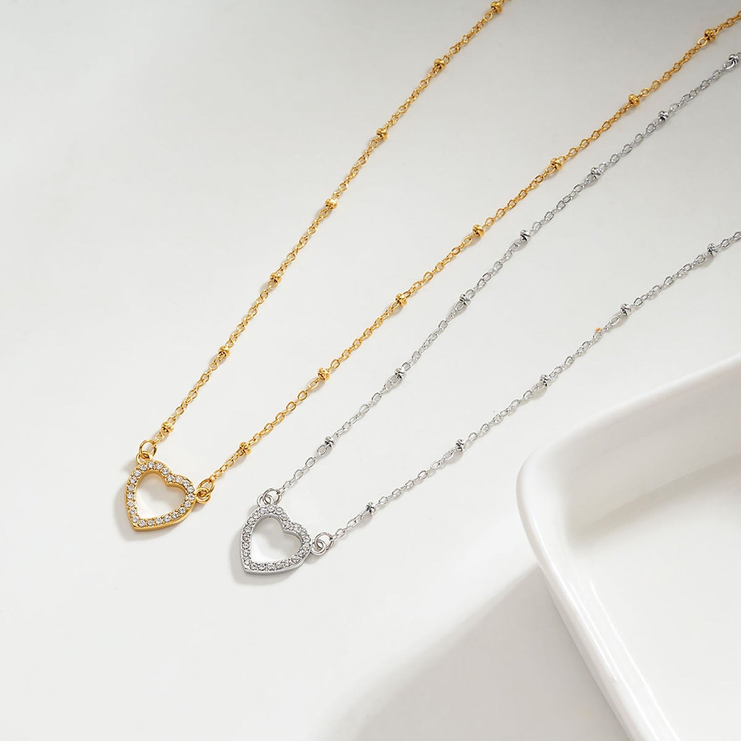 Style CHERISH Gold: Beaded Chain Anchoring an Elegant Pavé Heart Charm Pendant