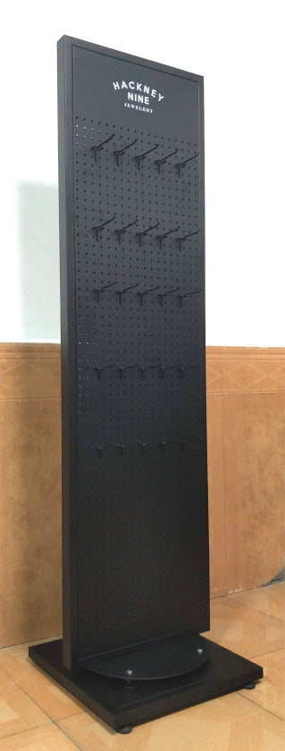 HACKNEY NINE Double-Sided Spinning Metal Floor Display Stand – Black Matte Luxe Pegboard With Logo