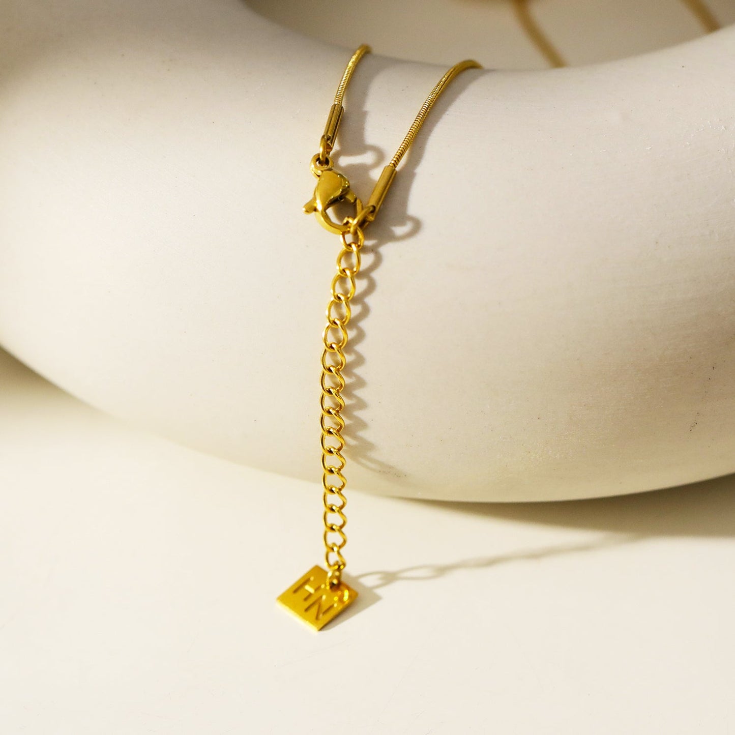 GARNA: Mini Snake-Skin Chain with Zirconia-Adorned Oval Shaped Charms