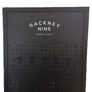 HACKNEY NINE Double-Sided Spinning Metal Floor Display Stand – Black Matte Luxe Pegboard With Logo