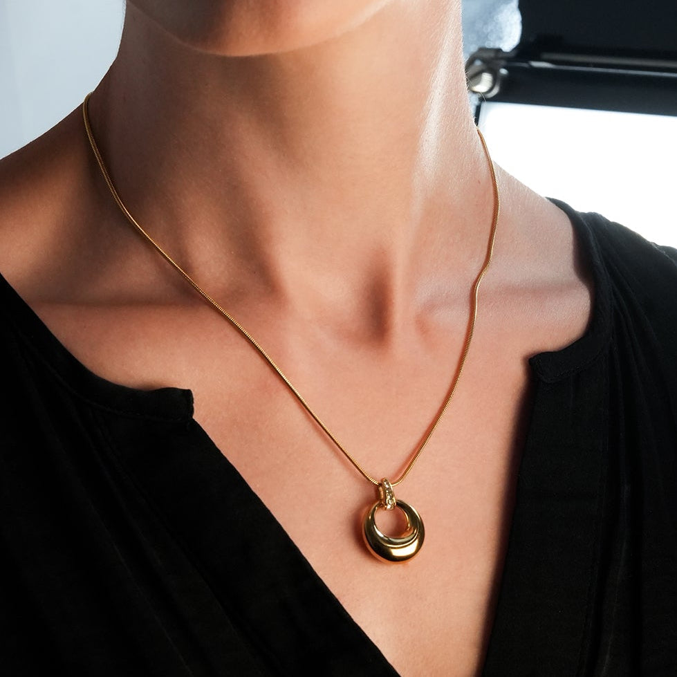 ALBASIMI: Snake Skin Chain with Zirconia (CZ) Embedded Clasp & Asymmetrical Circle Pendent.