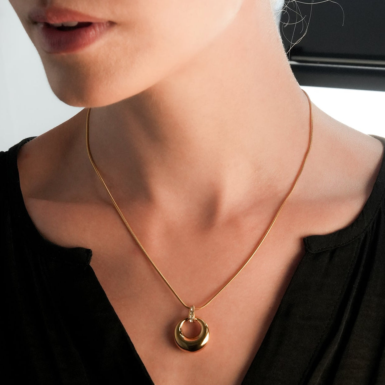 ALBASIMI: Snake Skin Chain with Zirconia (CZ) Embedded Clasp & Asymmetrical Circle Pendent.