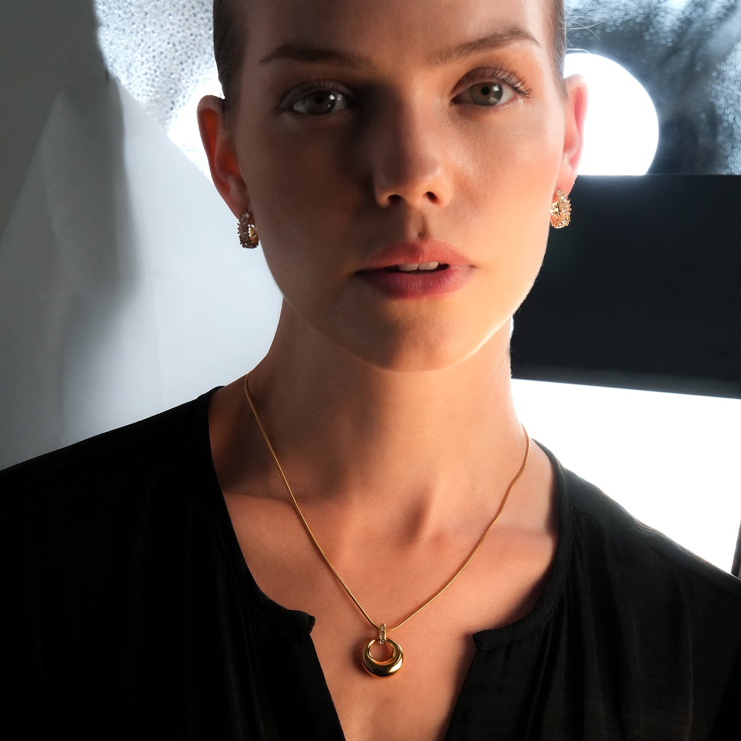 ALBASIMI: Snake Skin Chain with Zirconia (CZ) Embedded Clasp & Asymmetrical Circle Pendent.