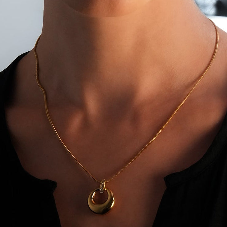 ALBASIMI: Snake Skin Chain with Zirconia (CZ) Embedded Clasp & Asymmetrical Circle Pendent.