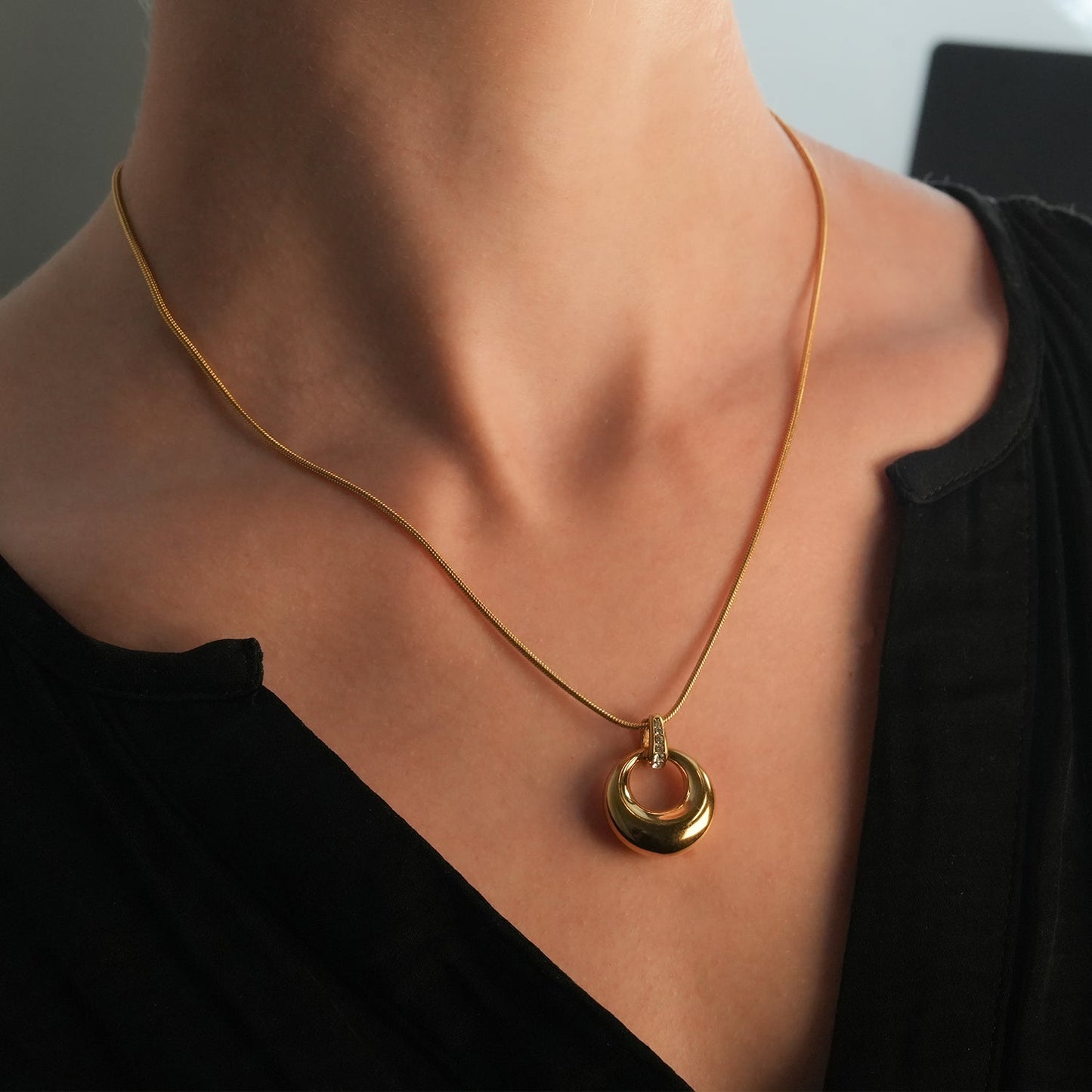 ALBASIMI: Snake Skin Chain with Zirconia (CZ) Embedded Clasp & Asymmetrical Circle Pendent.