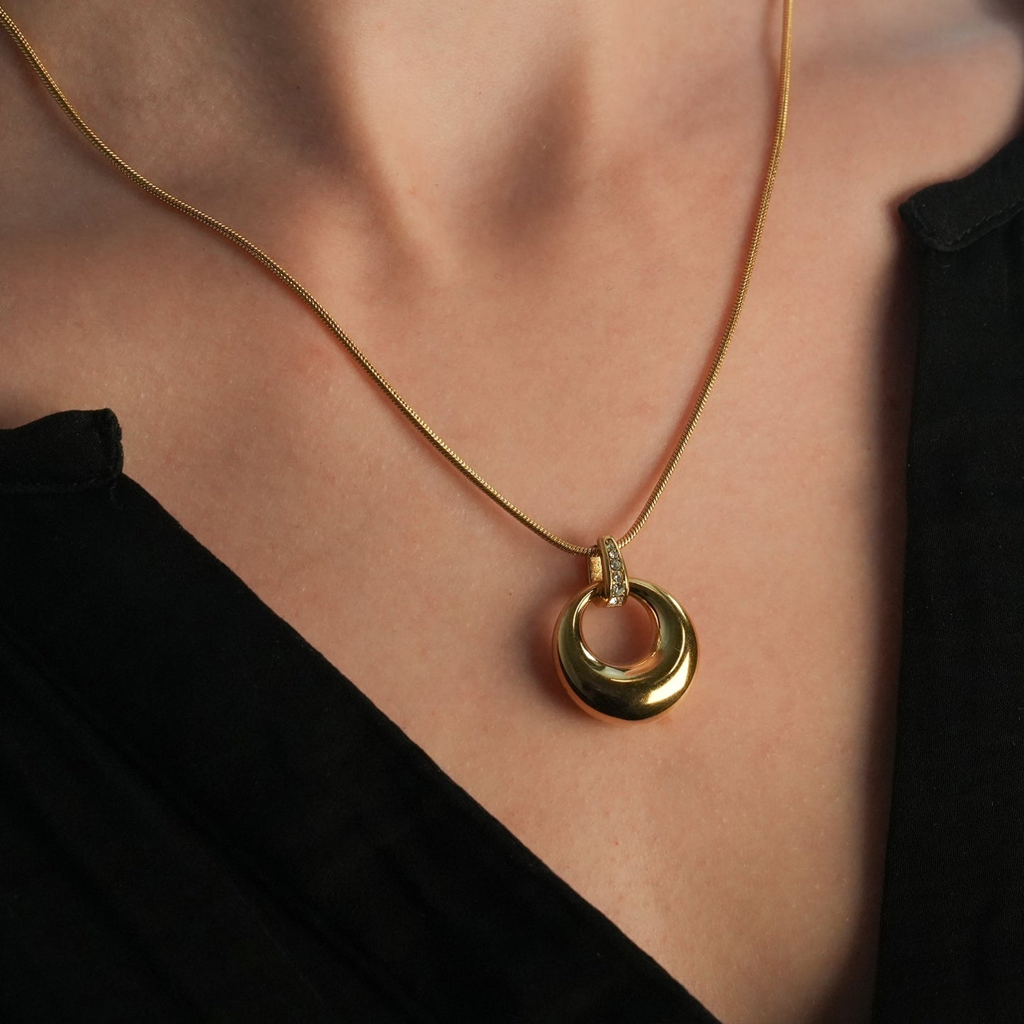 ALBASIMI: Snake Skin Chain with Zirconia (CZ) Embedded Clasp & Asymmetrical Circle Pendent.