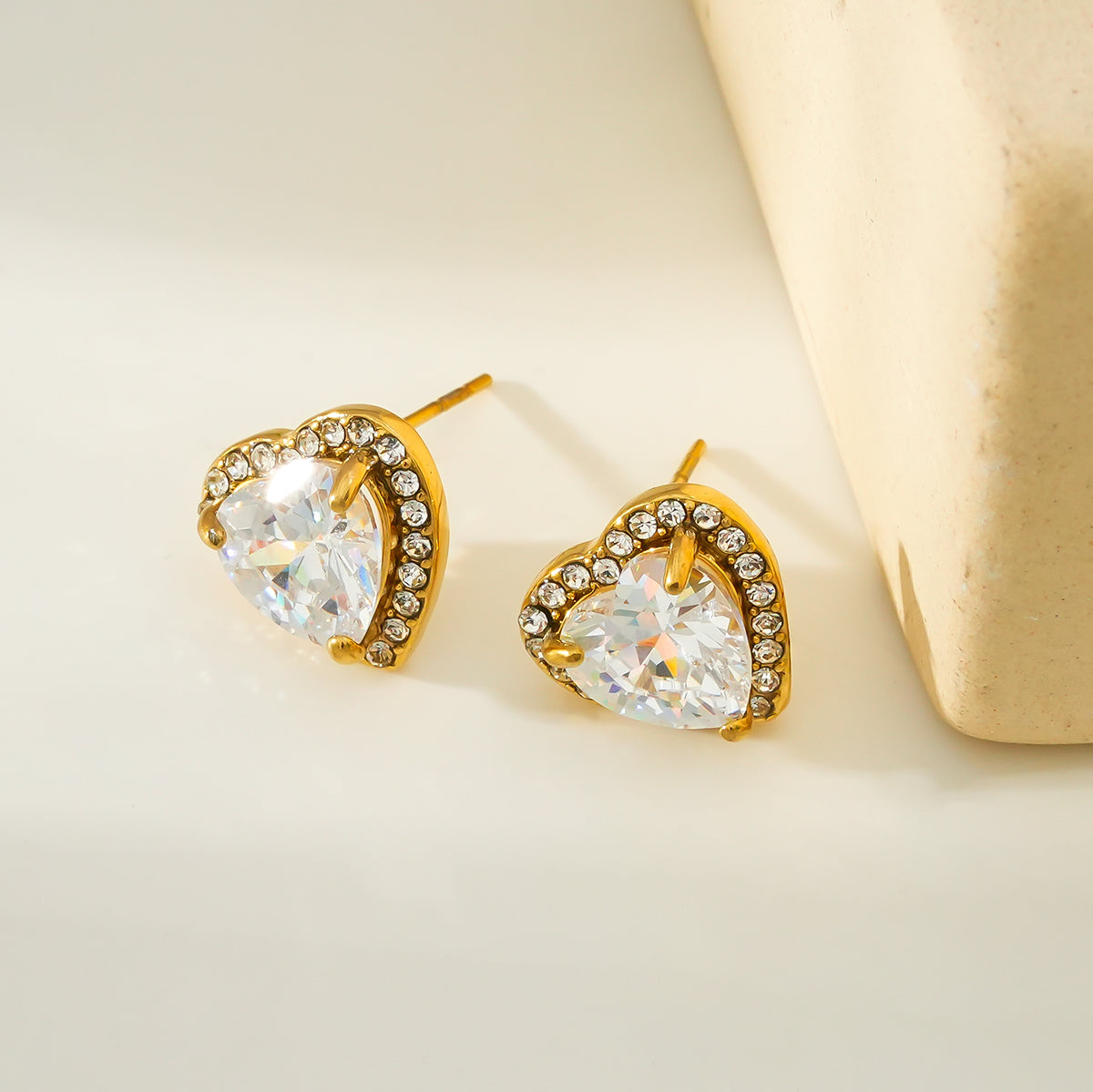 BANRAK Gold: Shimmering Heart Shaped Zirconia (CZ) Embedded Stud Earrings