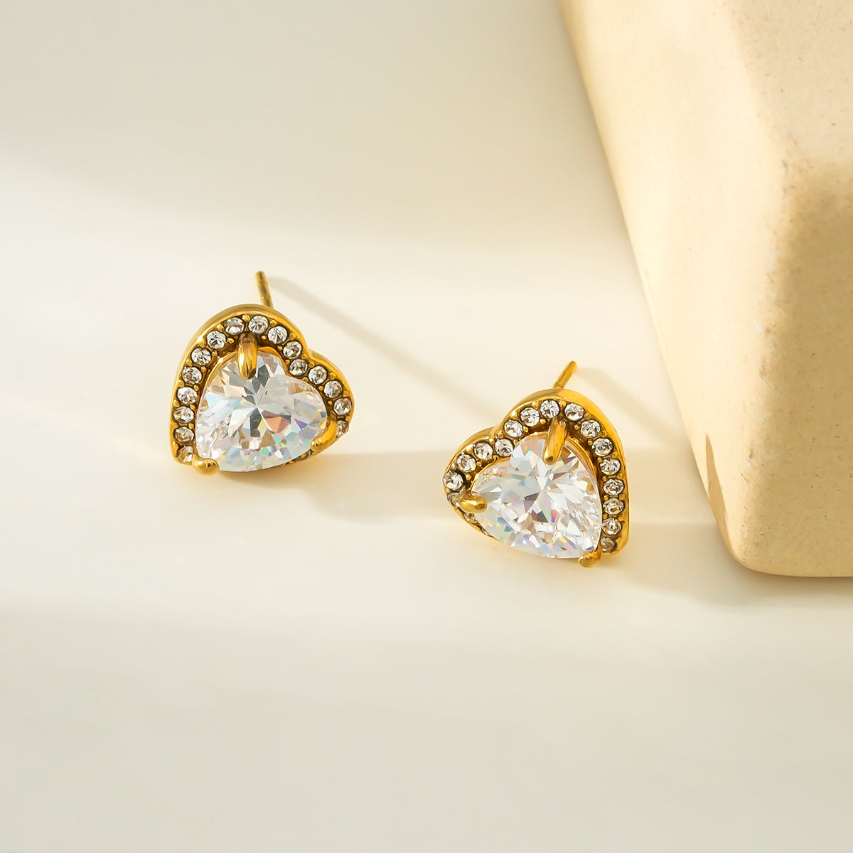 BANRAK Gold: Shimmering Heart Shaped Zirconia (CZ) Embedded Stud Earrings