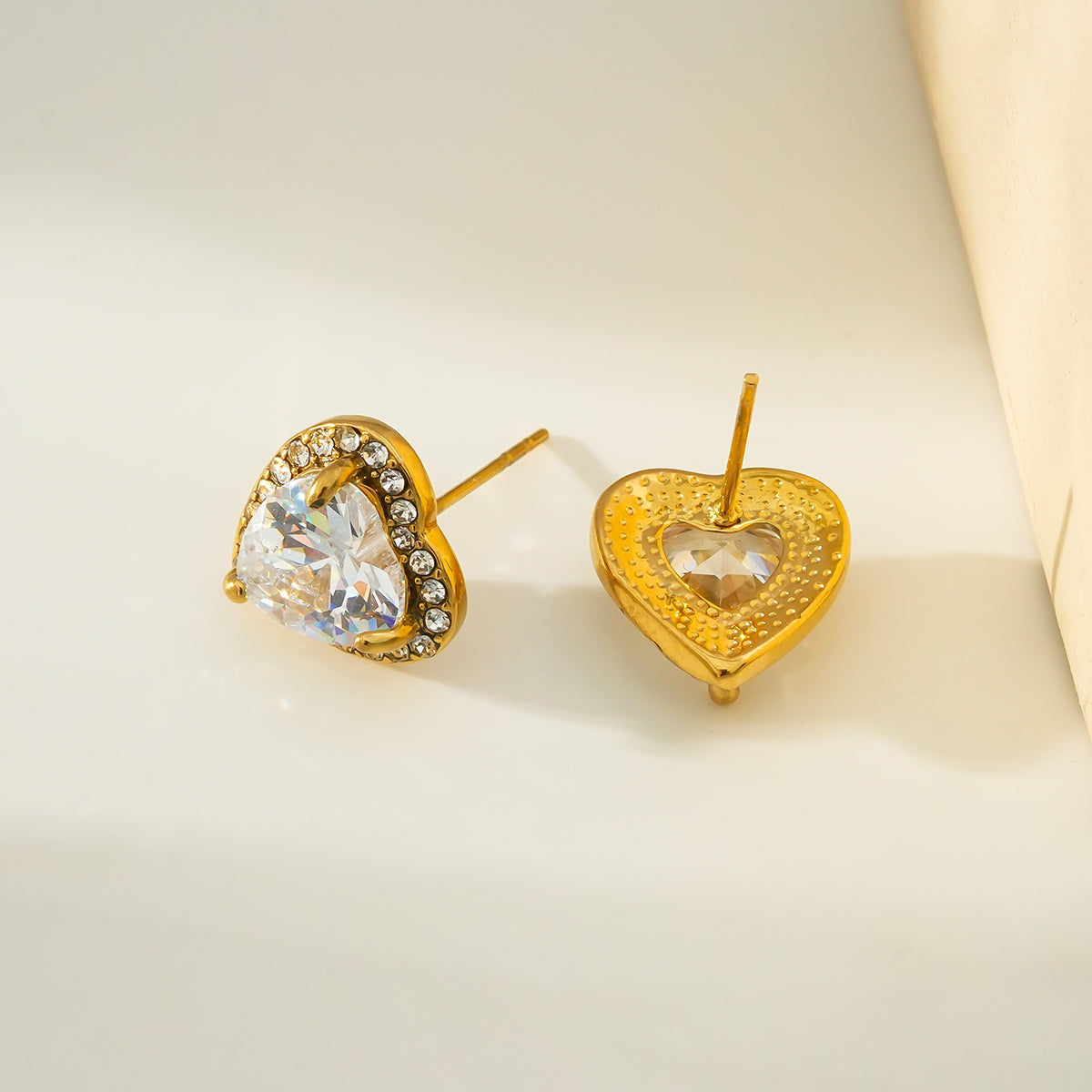 BANRAK Gold: Shimmering Heart Shaped Zirconia (CZ) Embedded Stud Earrings