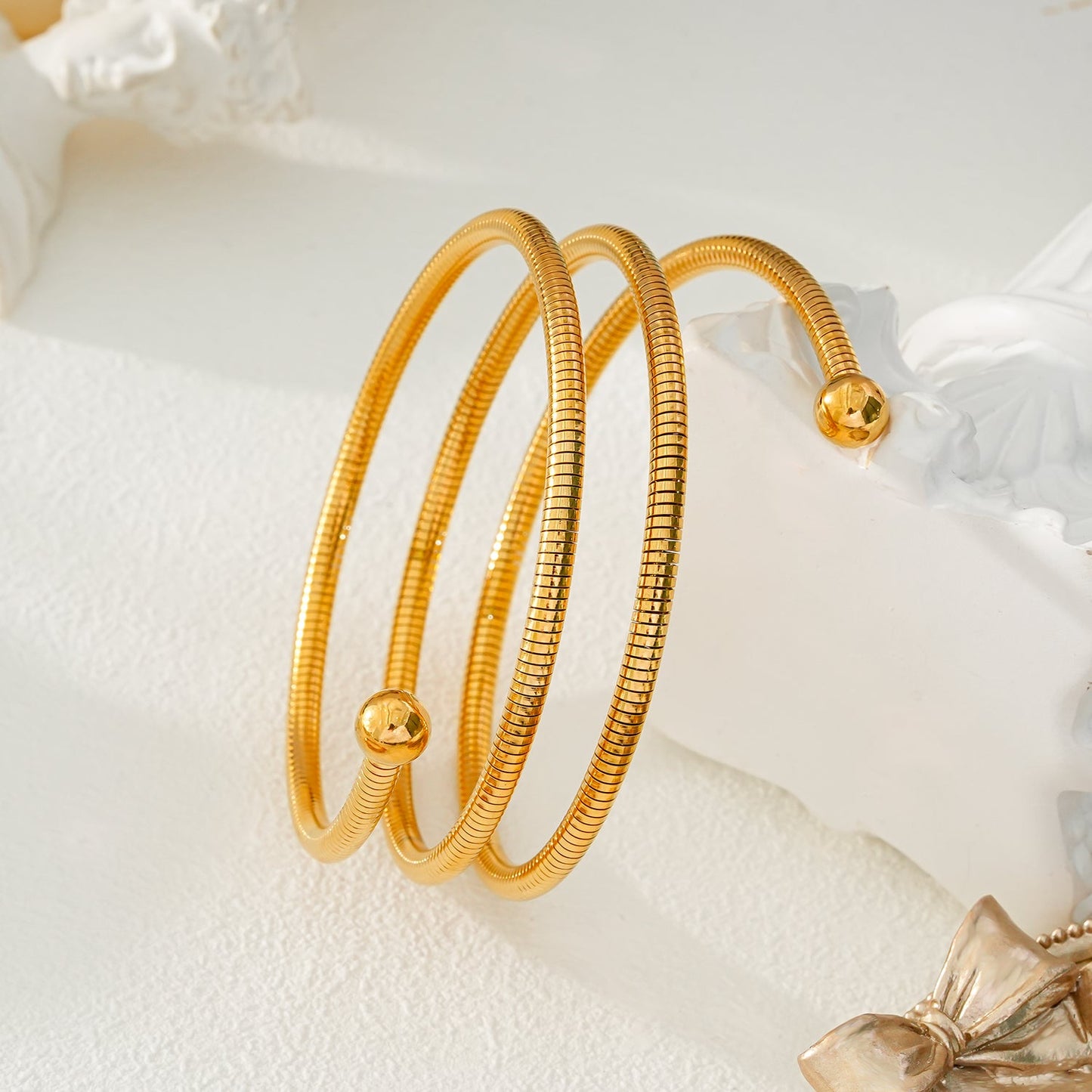 BASHEE: Triple Stacked Gold Bracelet with Surface Lines & Ball Bead Accents.