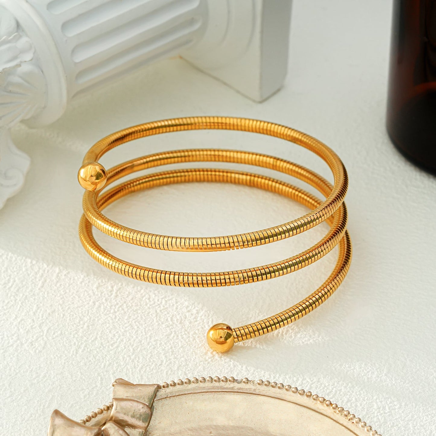 BASHEE: Triple Stacked Gold Bracelet with Surface Lines & Ball Bead Accents.