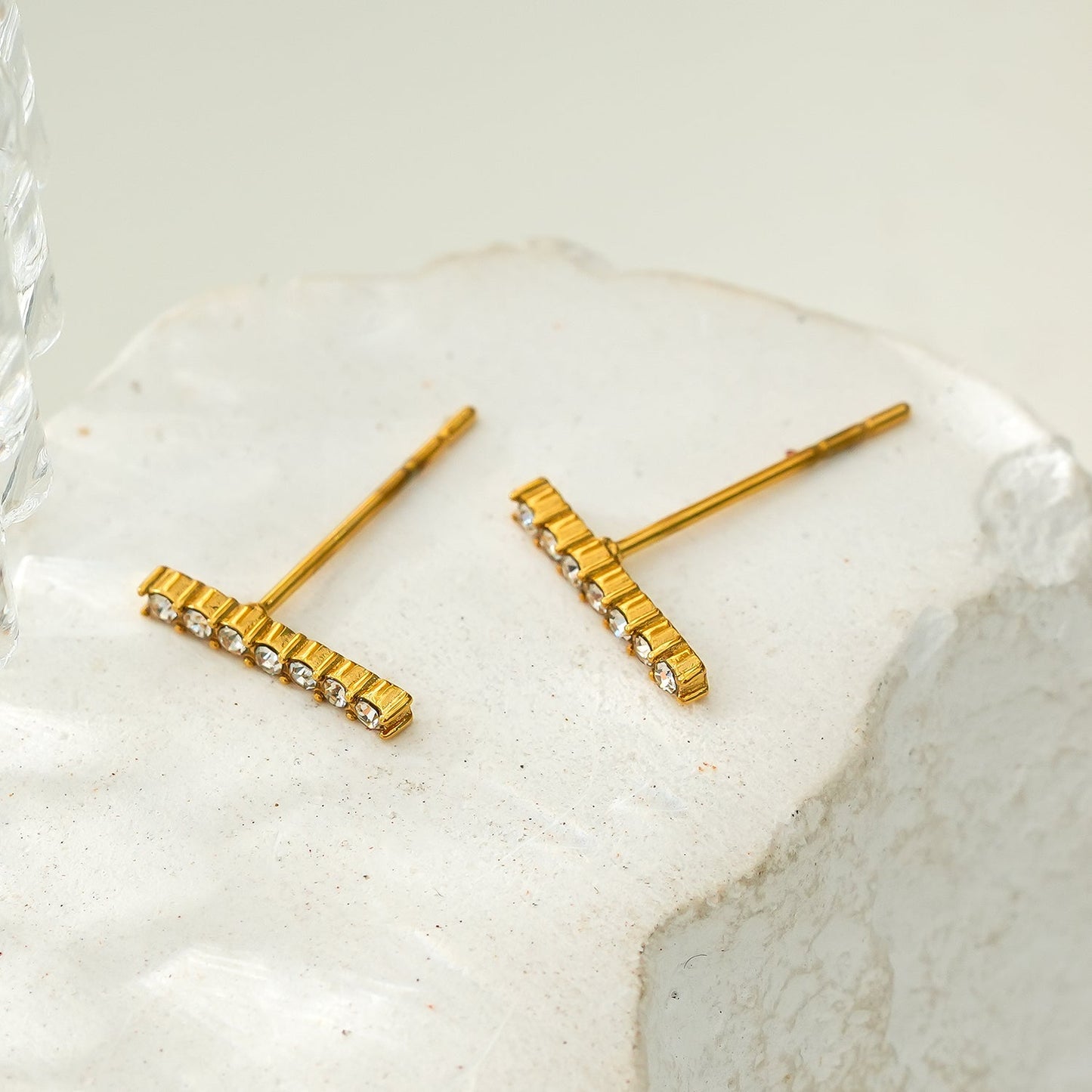 BIHAR: Minimalist Pavé Zirconia Embedded Bar Stud Earrings in Gold.