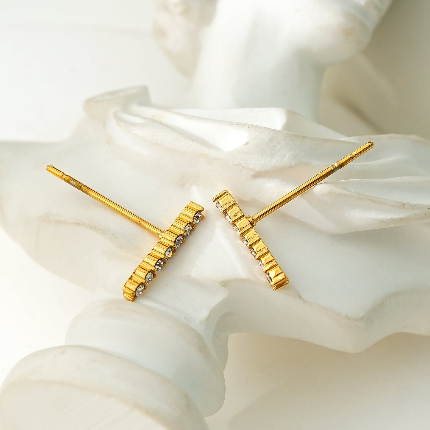 BIHAR: Minimalist Pavé Zirconia Embedded Bar Stud Earrings in Gold.