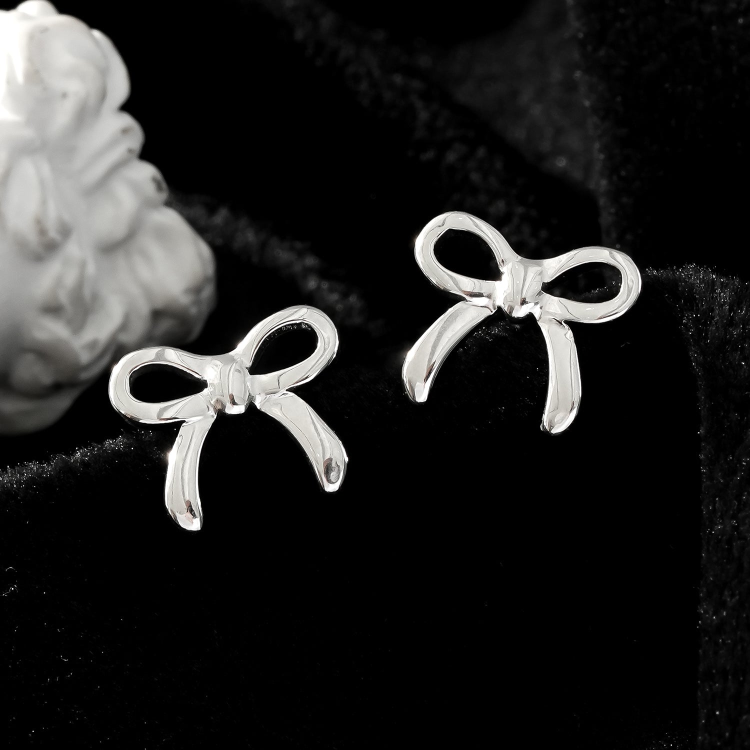 BOW: Silver Toned White Gold Bow Shaped Stud Earrings