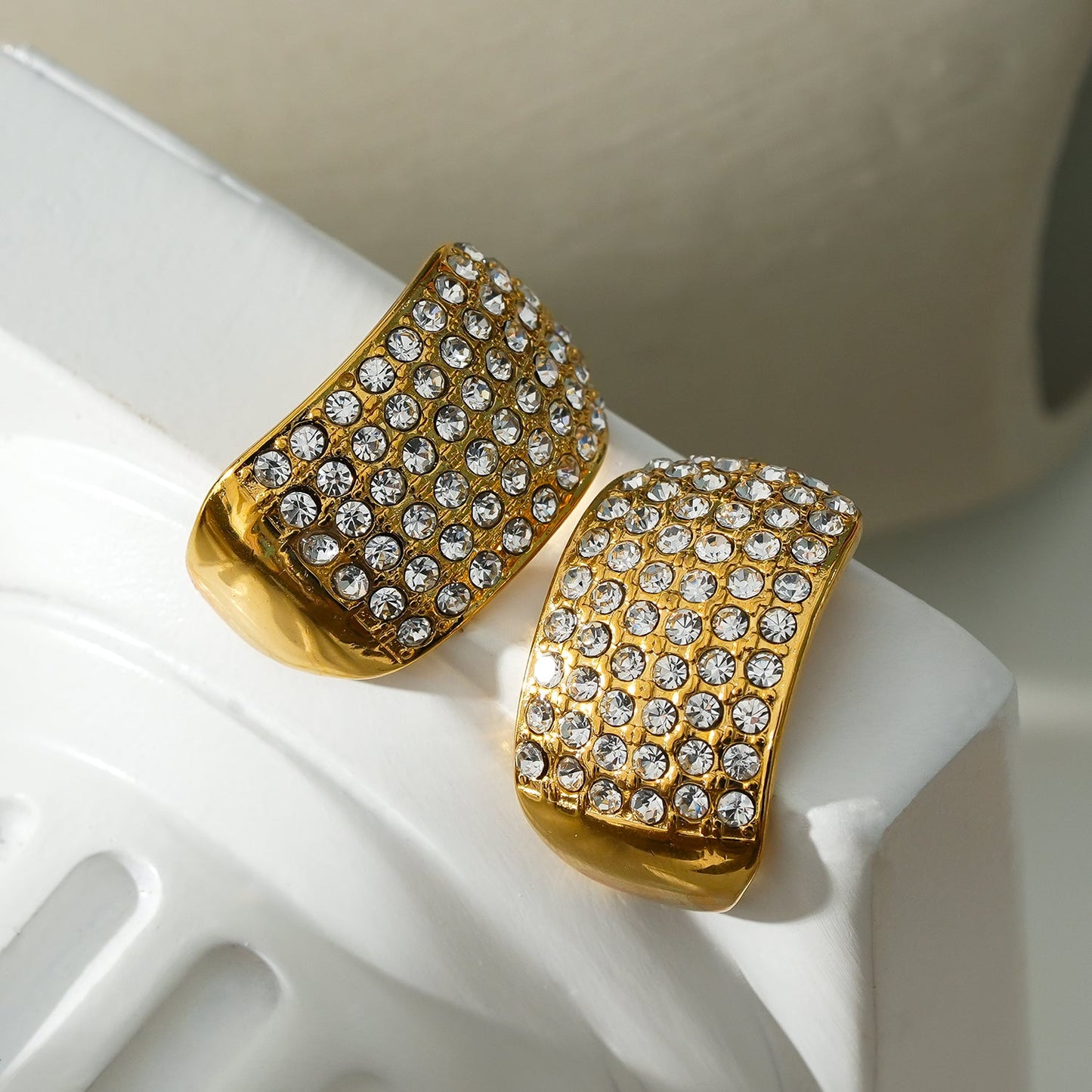 Style CARMEL: Curved Pavé Zirconia Stud Earrings in Gold