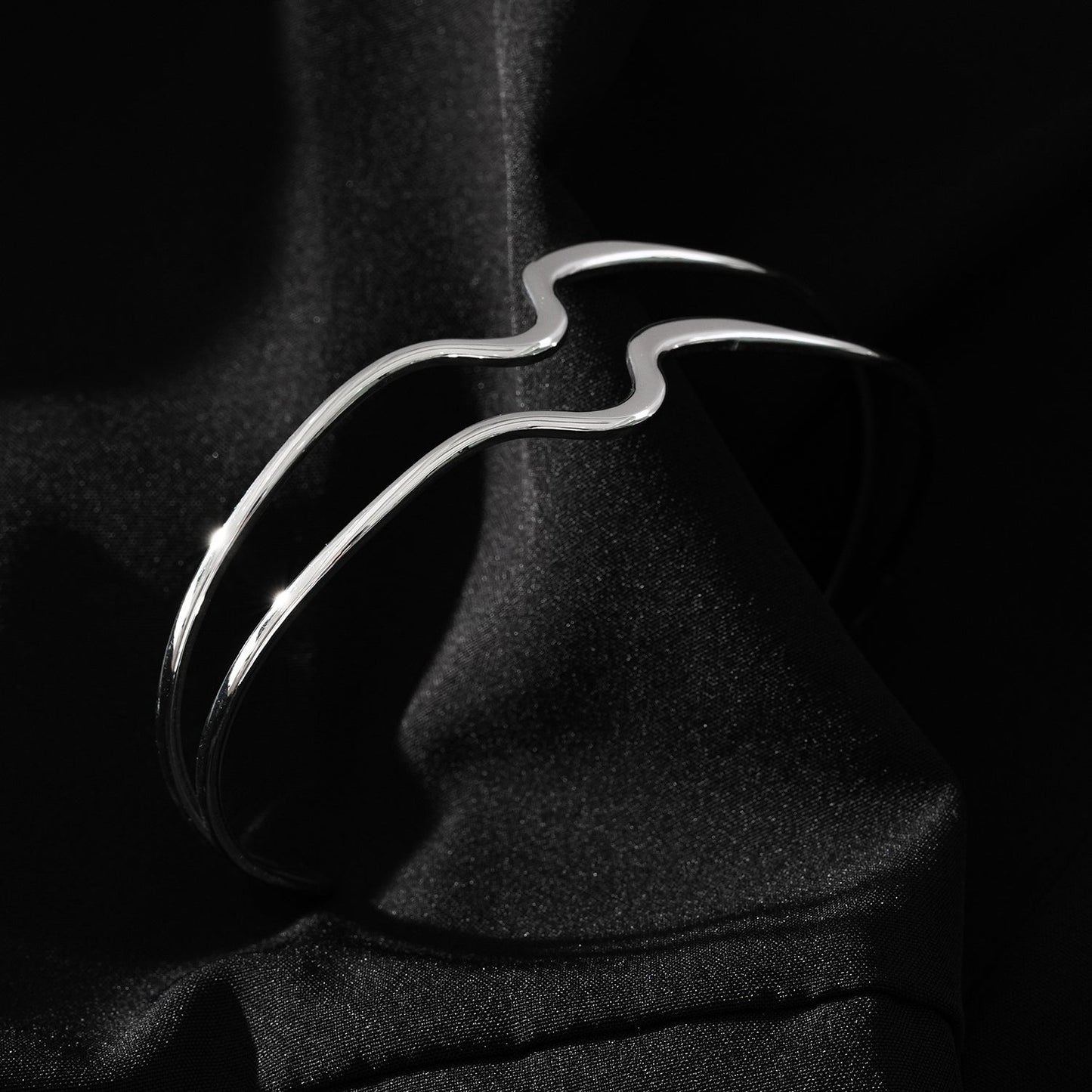 Style CHITRA: Industrial-Chic Bracelet with Abstract Shaped Parallel Bands in Silver