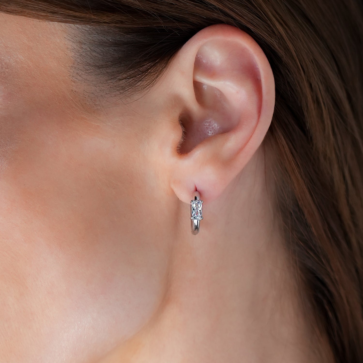 Style CONWYN: Retro Style Hoops with an Encased Clear Zirconia Charm in Silver.