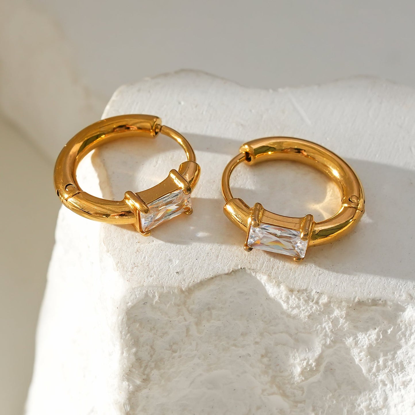 Style CONWYN: Retro Style Hoops with an Encased Clear Zirconia Charm.