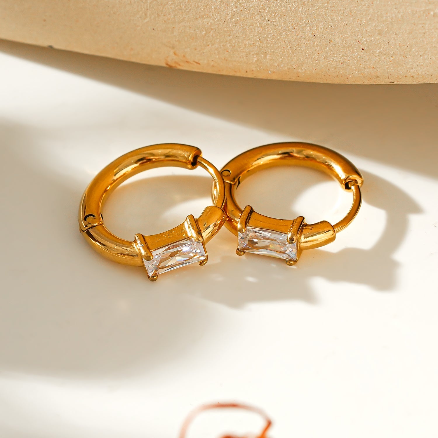 Style CONWYN: Retro Style Hoops with an Encased Clear Zirconia Charm.