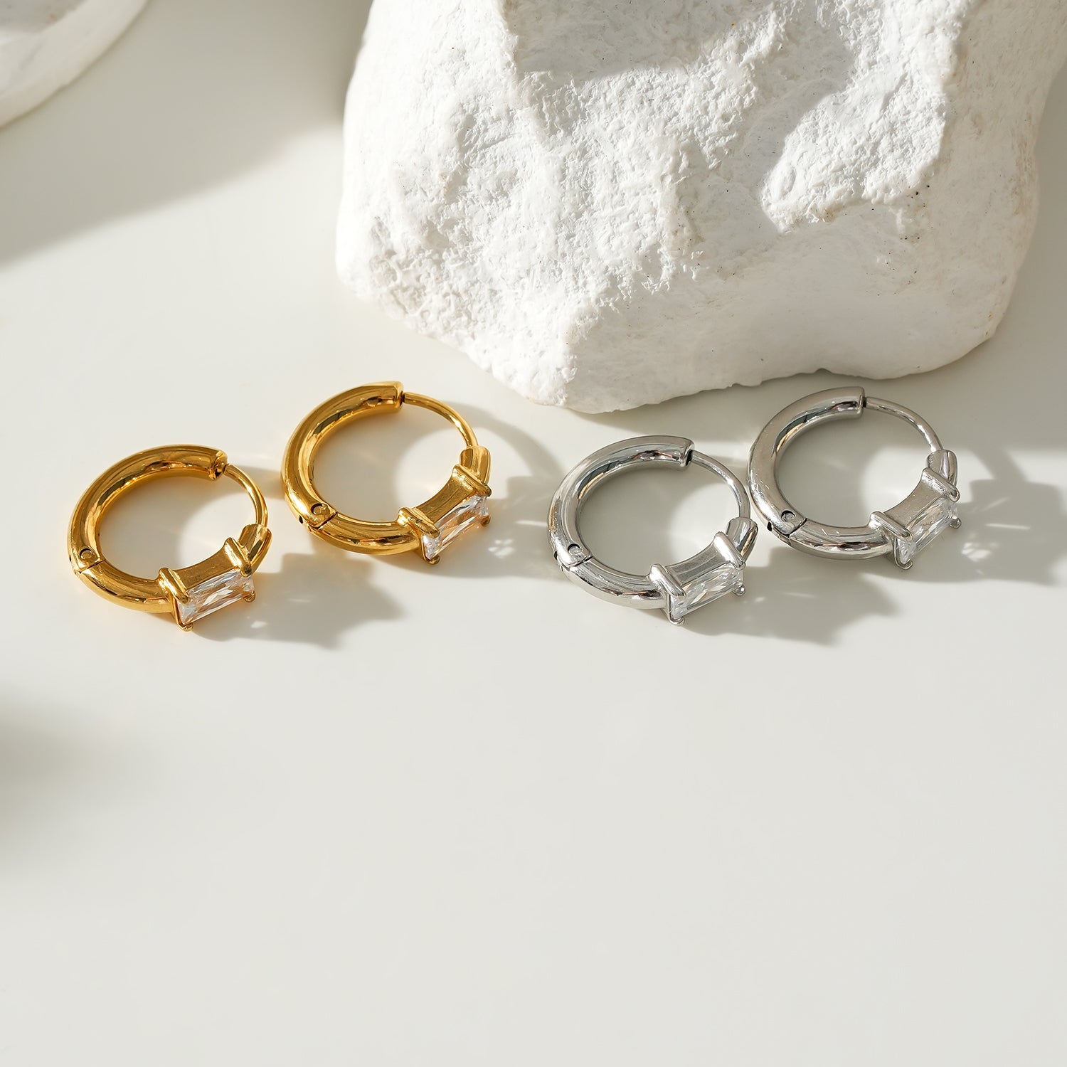 Style CONWYN: Retro Style Hoops with an Encased Clear Zirconia Charm.