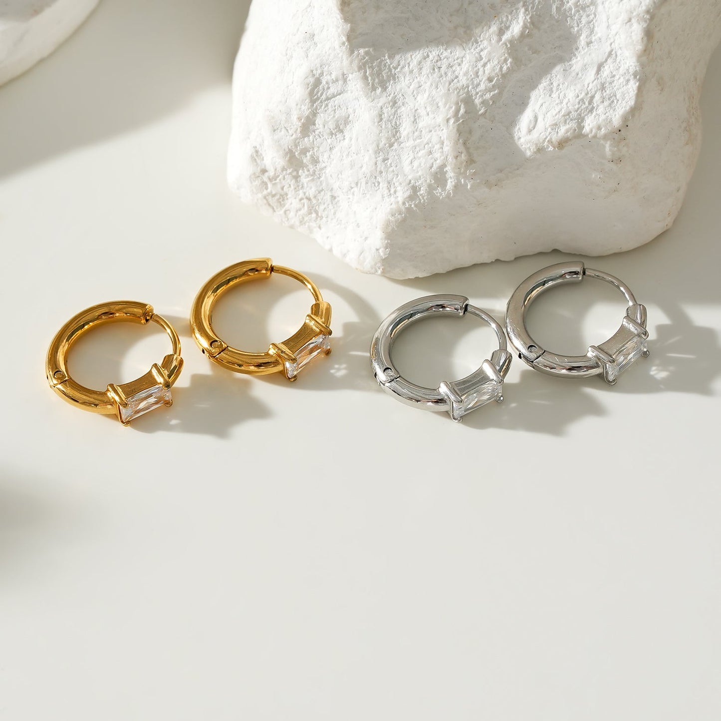 Style CONWYN: Retro Style Hoops with an Encased Clear Zirconia Charm in Silver & Gold.