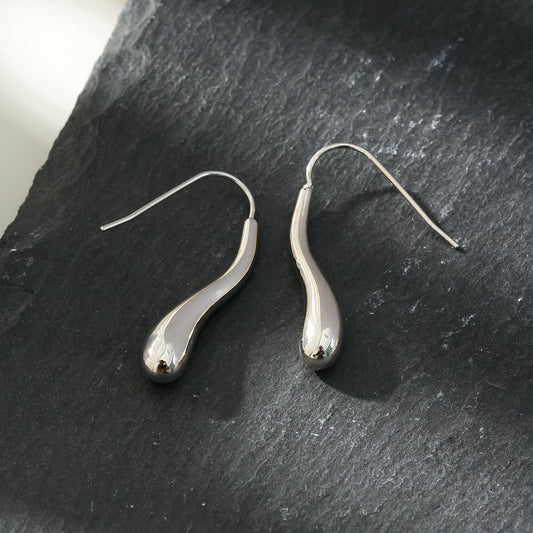 Style CORNING Silver Toned (White Gold): Tadpole-Shaped Earrings – Unique Elegance with a Playful Twist