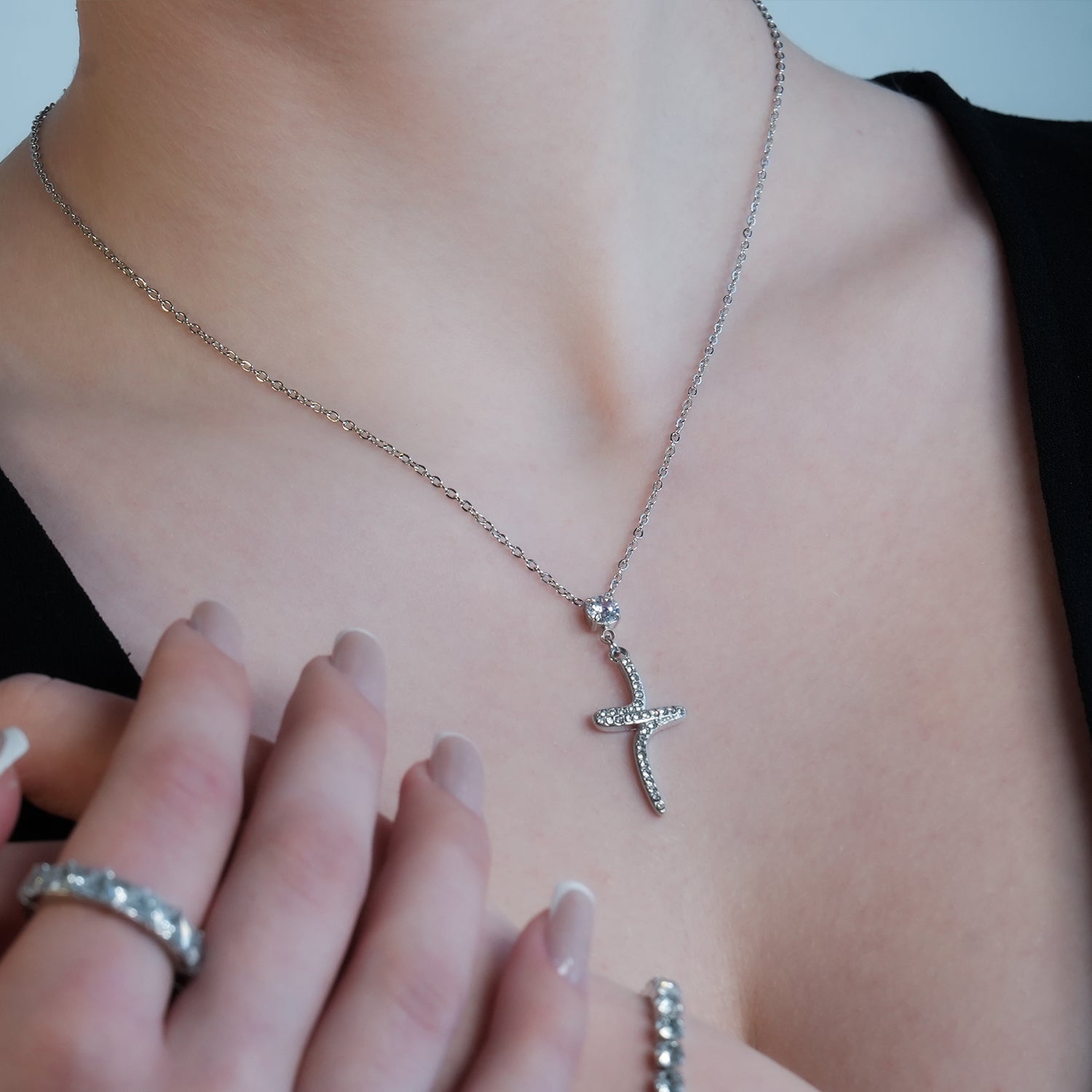 CRISTO Silver Toned White Gold: Dainty Beaded Chain Necklace with an Abstract Textured Cross Pendent