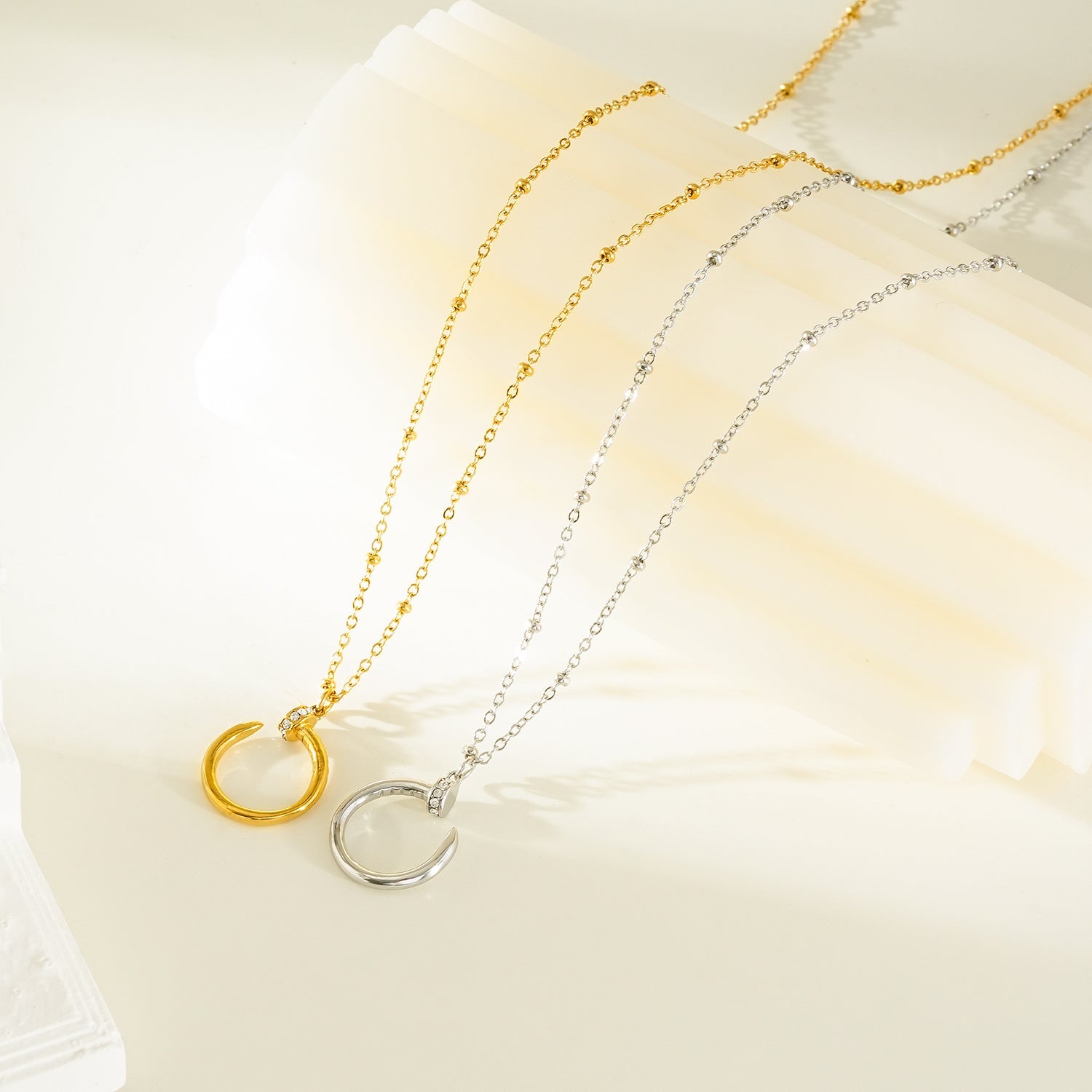 CSENGE Gold Necklace:  Zirconia Embedded Circular Nail Pendant on a Satellite Beaded Chain
