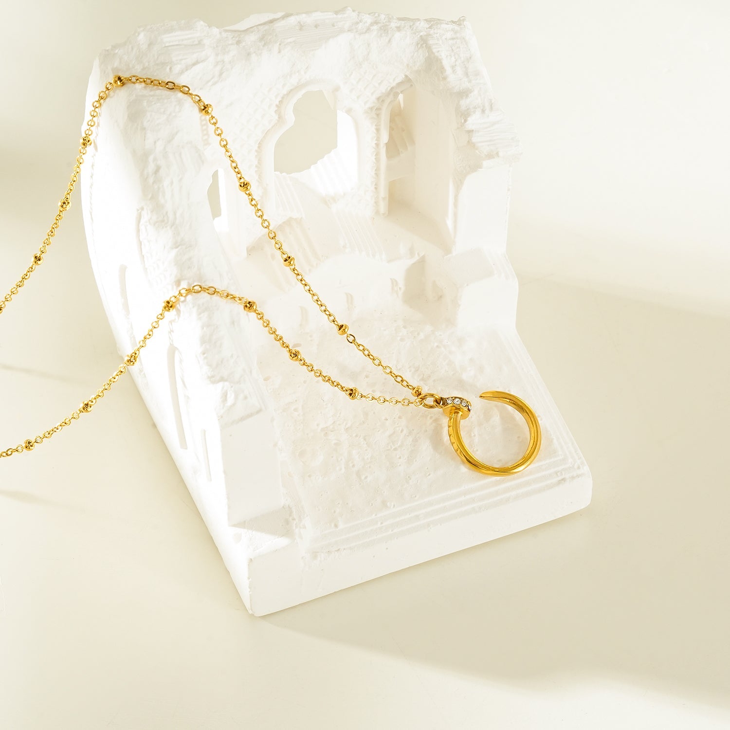 CSENGE Gold Necklace:  Zirconia Embedded Circular Nail Pendant on a Satellite Beaded Chain