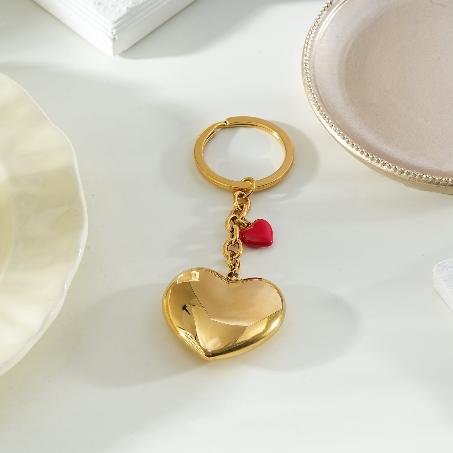 AKAMAI Gold: Golden Heart Charm Key Ring with Red Enamel Accent