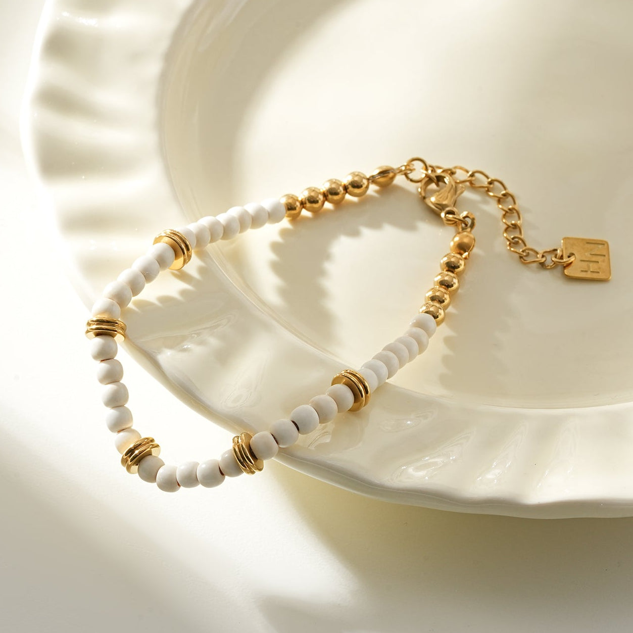 JAMILAH Gold: White Turquoise Stones and Gold Beaded Bracelet.