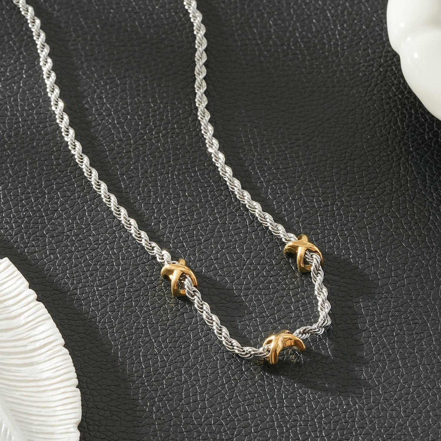 COSMINA Mixed Metals: Silver Rope Chain Necklace with Triple Mini Gold Criss-Cross Charms