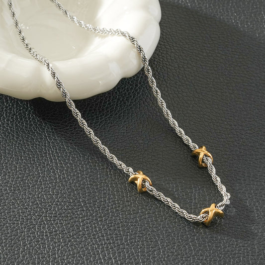 COSMINA Mixed Metals: Silver Rope Chain Necklace with Triple Mini Gold Criss-Cross Charms