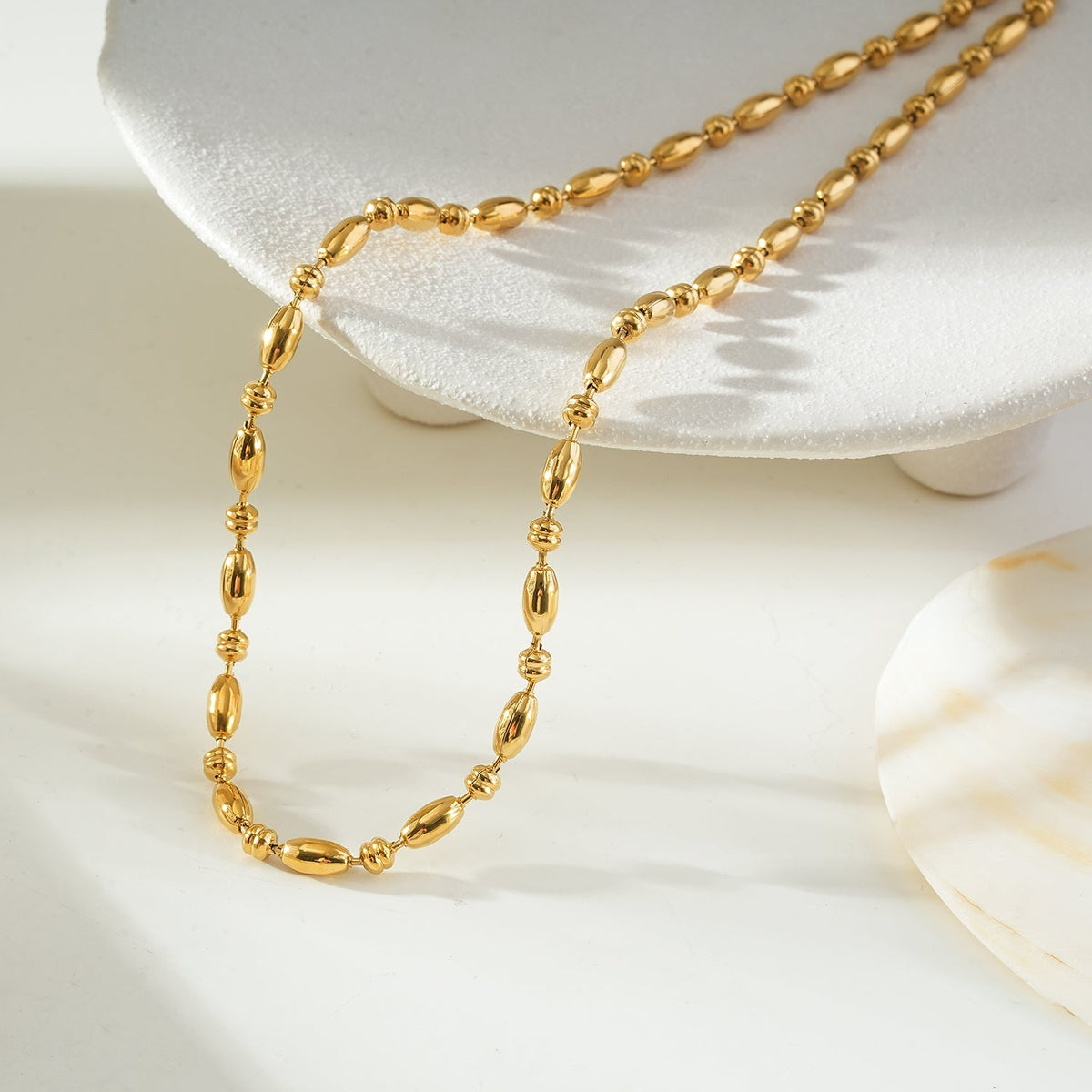 NEEMA Gold: Polished Oval Bead Necklace – Sculpted Statement Jewellery $35