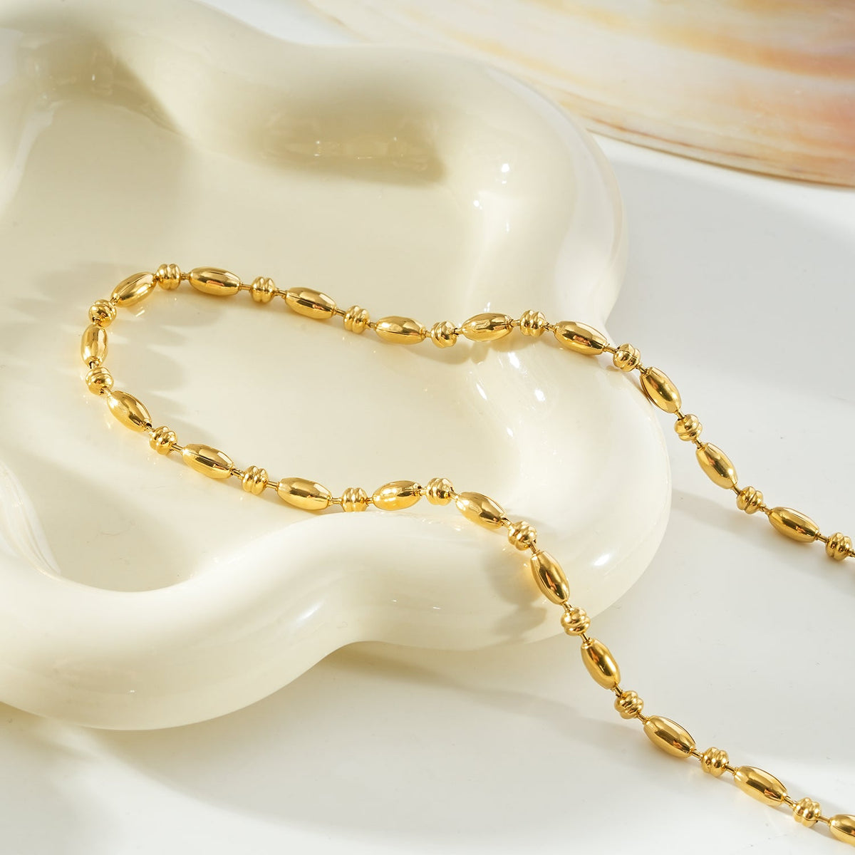 NEEMA Gold: Polished Oval Bead Necklace – Sculpted Statement Jewellery $35