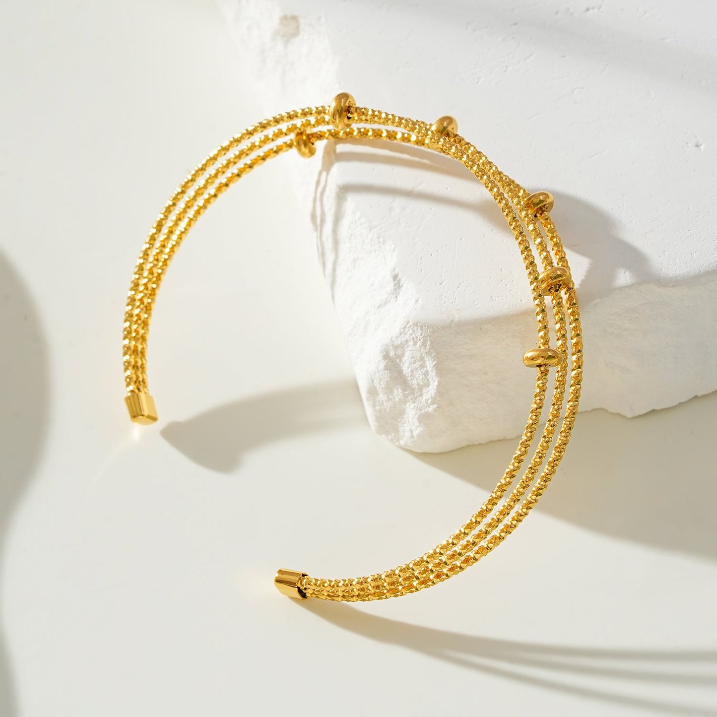 Style FARZIKA Gold: Triple Stacked Textured Beaded Bracelet