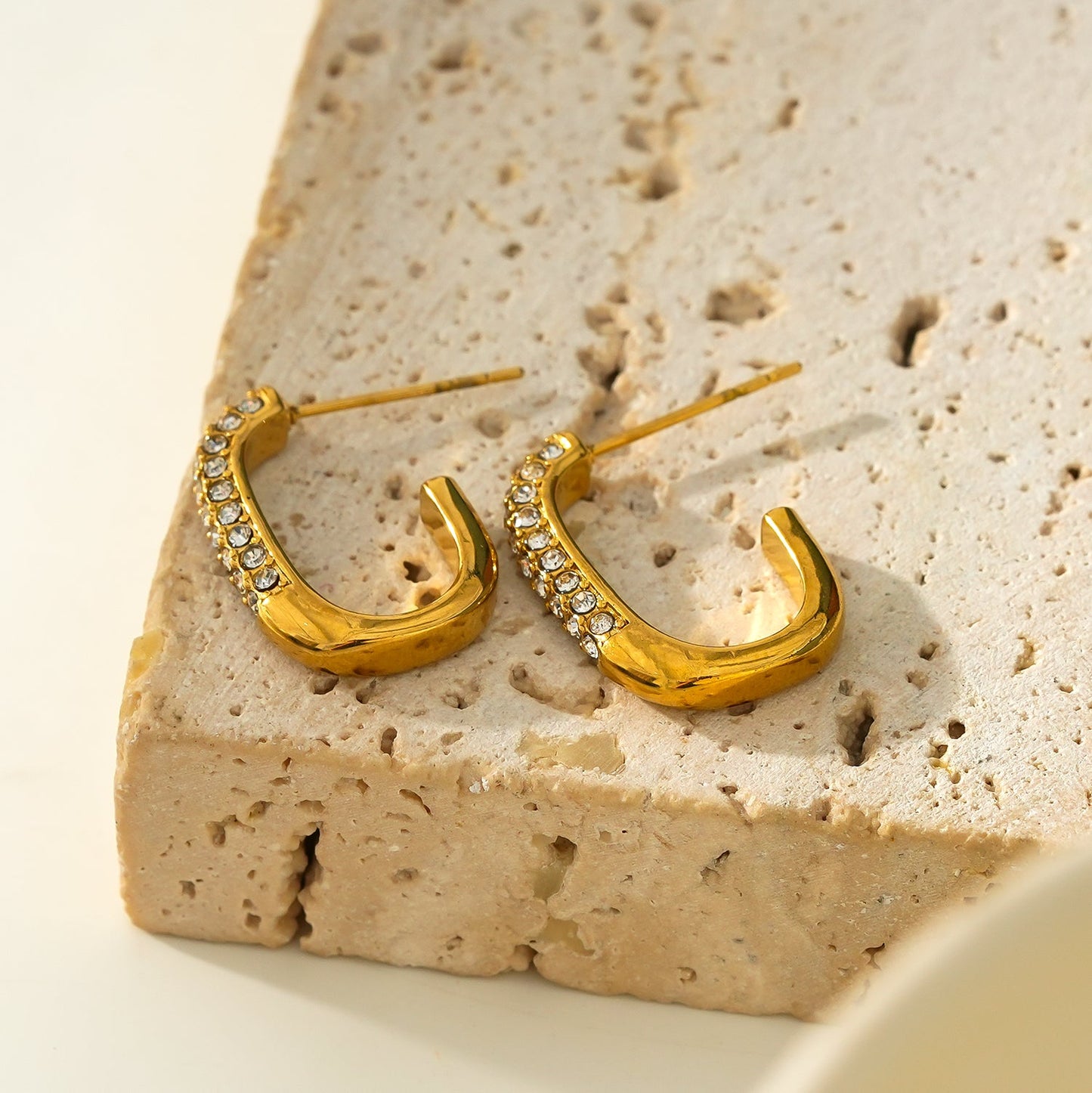 Style FIRLE: Partial Pavé Zirconia Oval Hoop Earrings