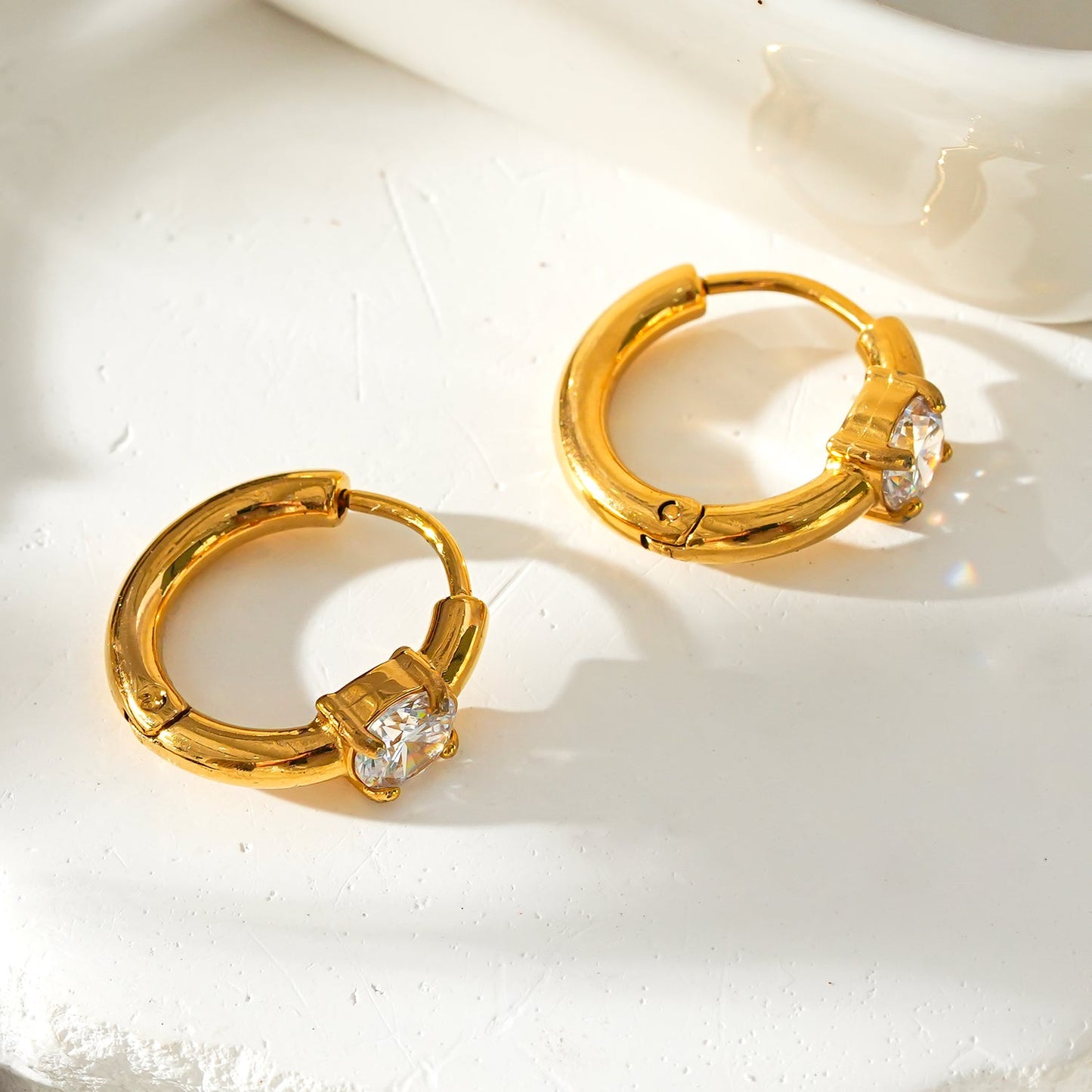 GALENA Gold: Mini Hoop Gold Earrings with a Rounded Moissanite Stone