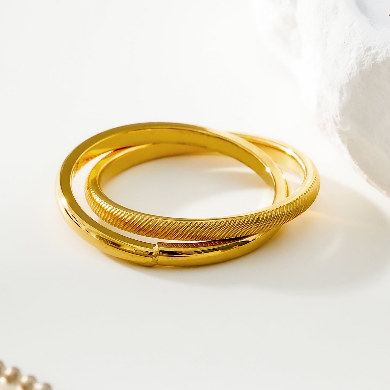 GILBERT: Double Banded Interconnected Stack Ring in Gold