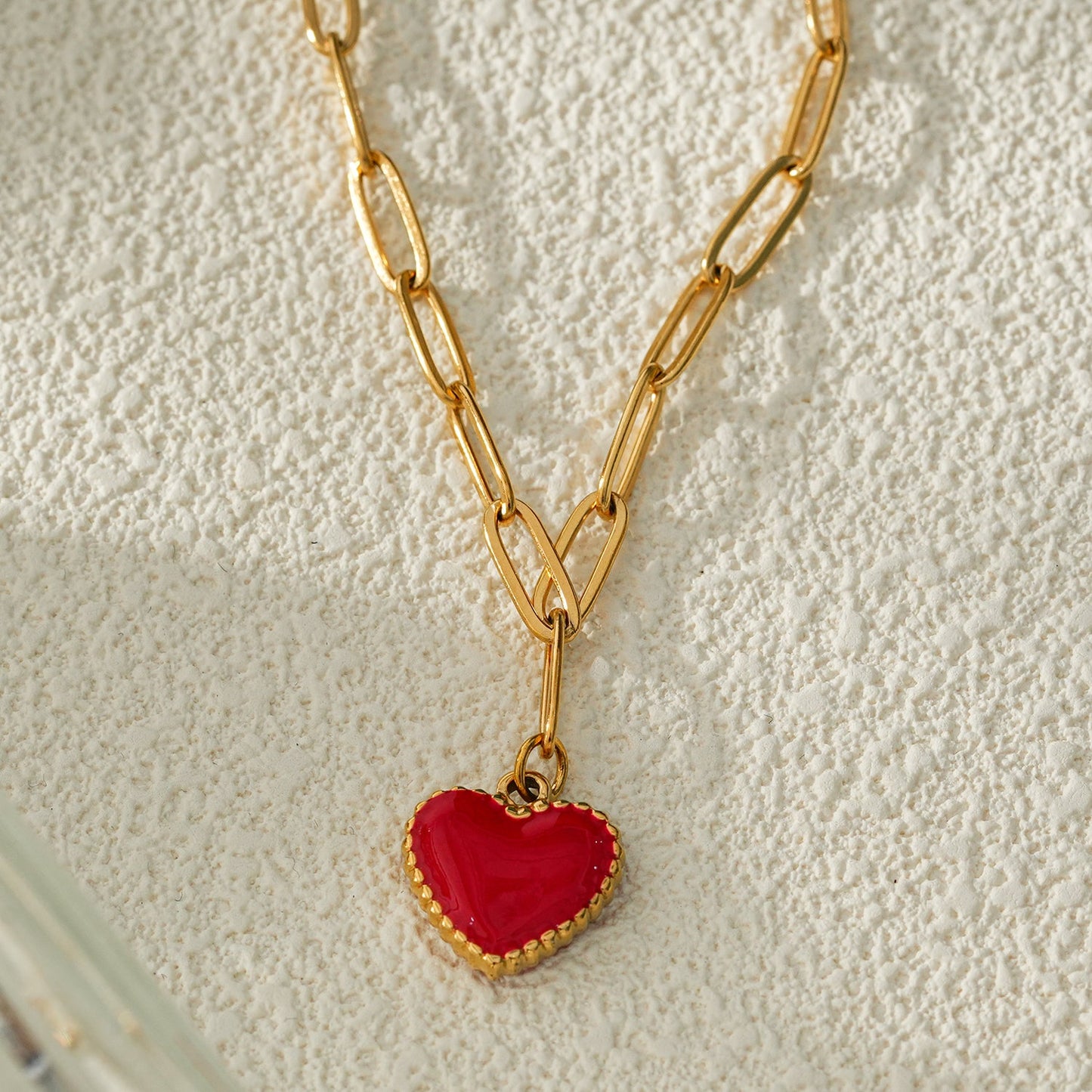 HEART ROUGE Gold: Paper Clip Chain Anchoring an Enameled Red Heart Charm