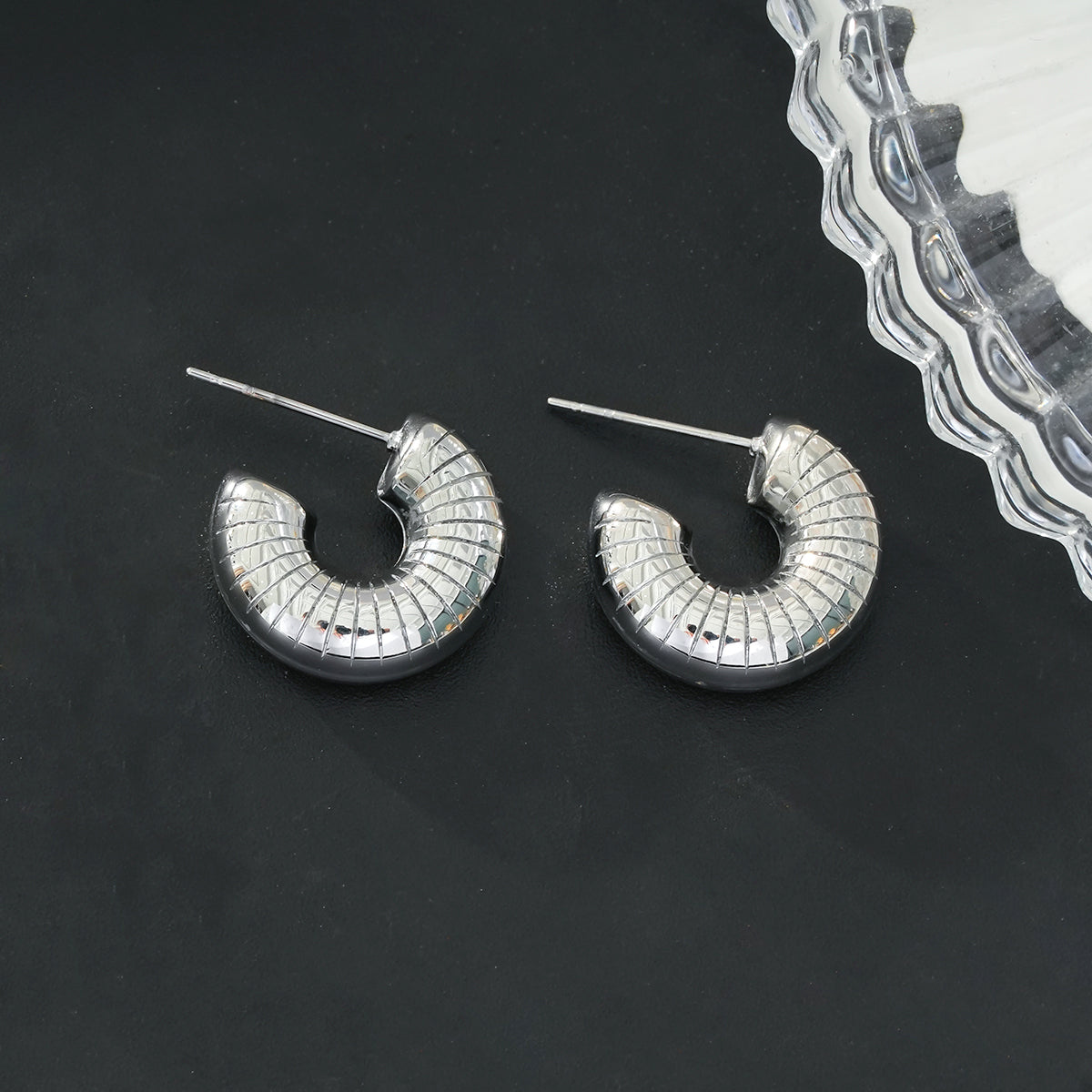 KOTOHIRA: Hollow Chunky-Look Textured Surface Tube Hoop Earrings in Silver Toned White Gold