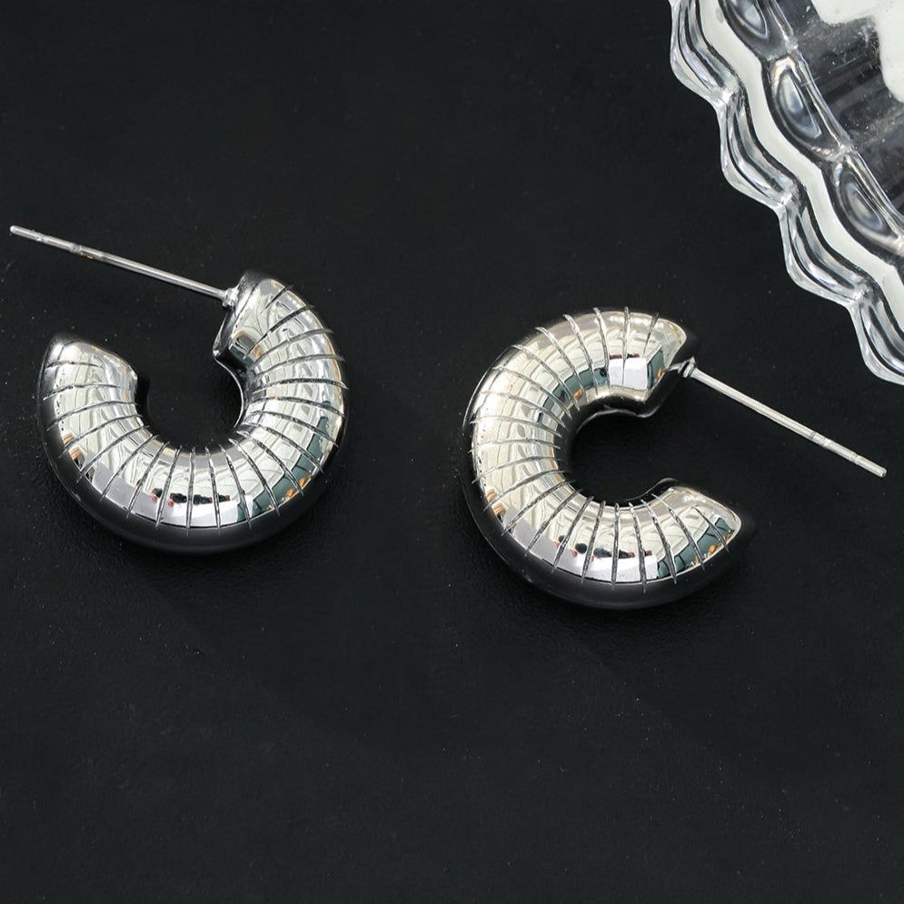 KOTOHIRA: Hollow Chunky-Look Textured Surface Tube Hoop Earrings in Silver Toned White Gold