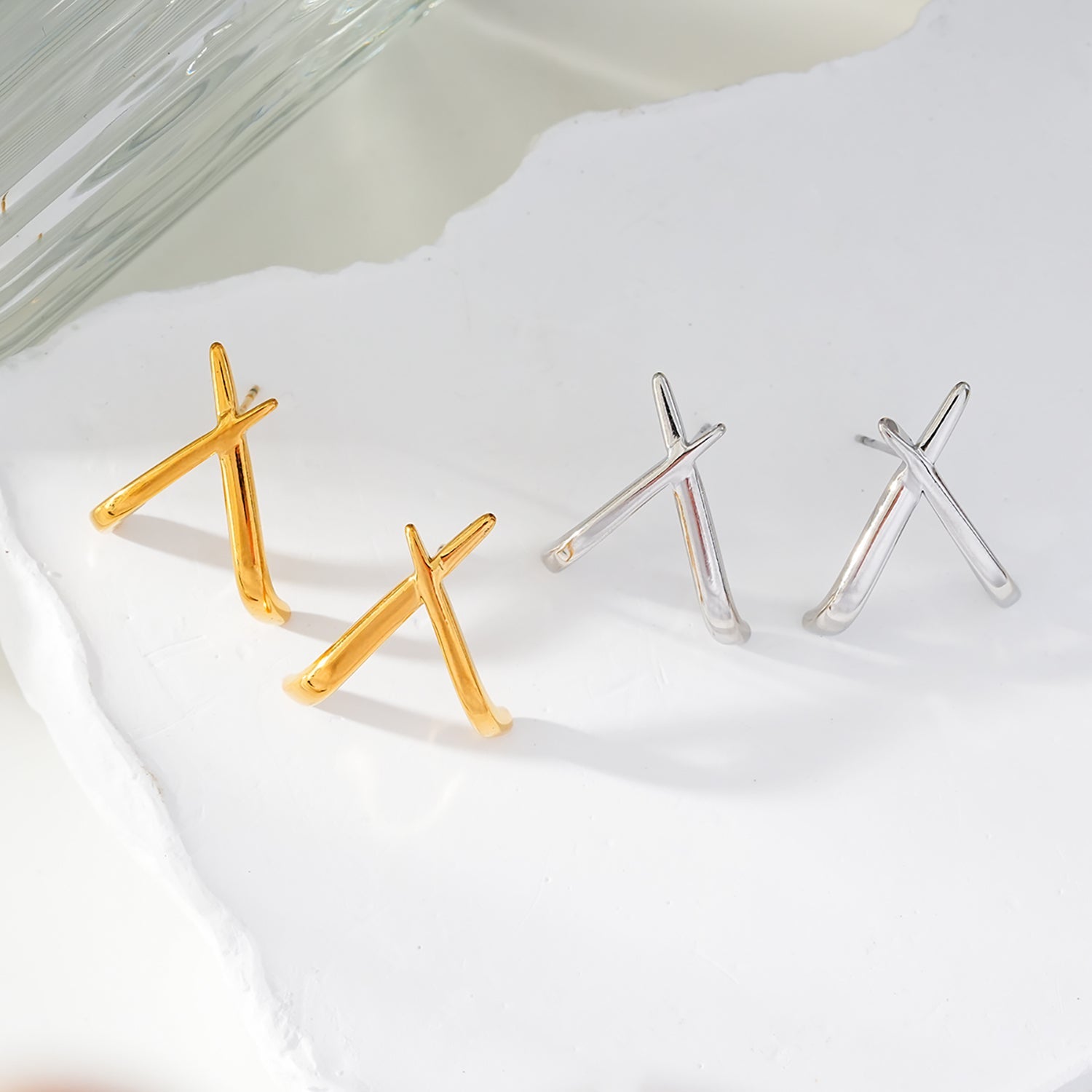 LINDSBORG: Criss-Cross Geometric Stud Earrings in Gold & White Gold