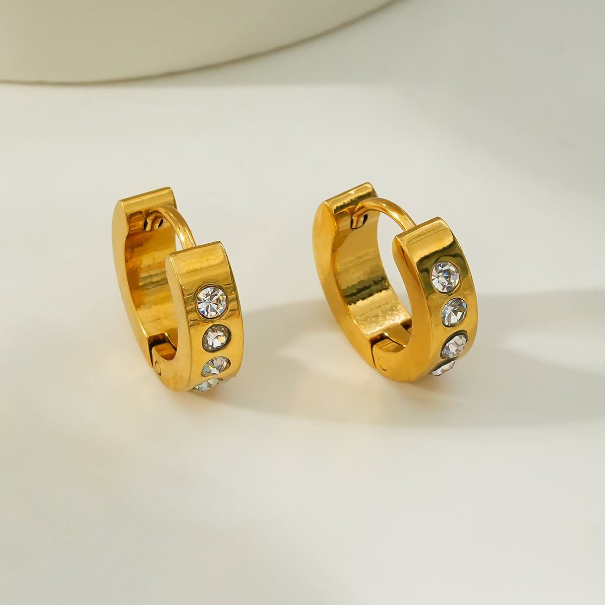 PAIA Gold: Wide Mini Hoop Gold Earrings with an Array of Zirconia (CZ) Gemstones