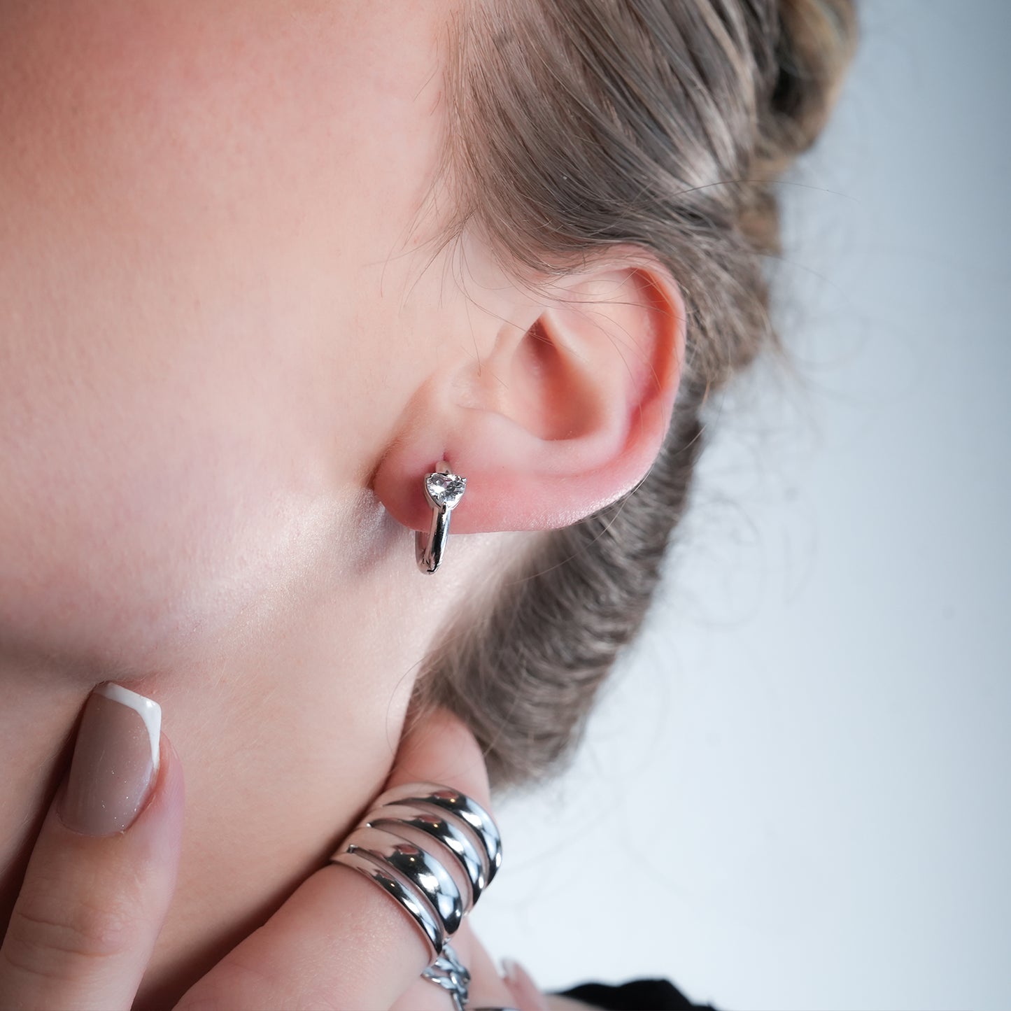 Style PELLA White Gold (Silver Toned): Mini Hoop Earrings with Heart Shaped Moissanite