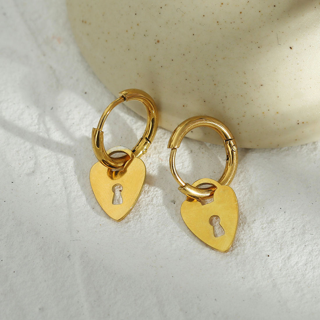 PYAR Gold: Mini Hoop Earrings Anchoring a Heart Shaped Keylock Charm
