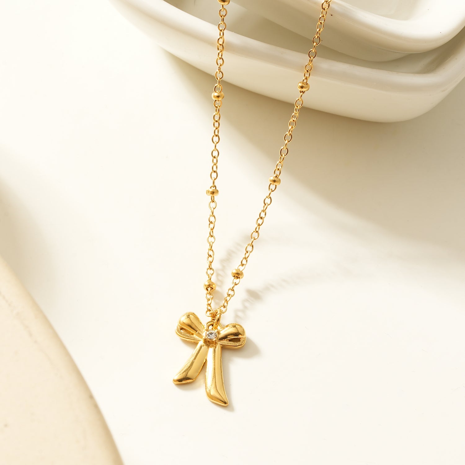 TALIANA Gold: Dainty Beaded Chain Necklace with Bow Pendant & Solitaire Zirconia – Elegant Everyday Jewelry