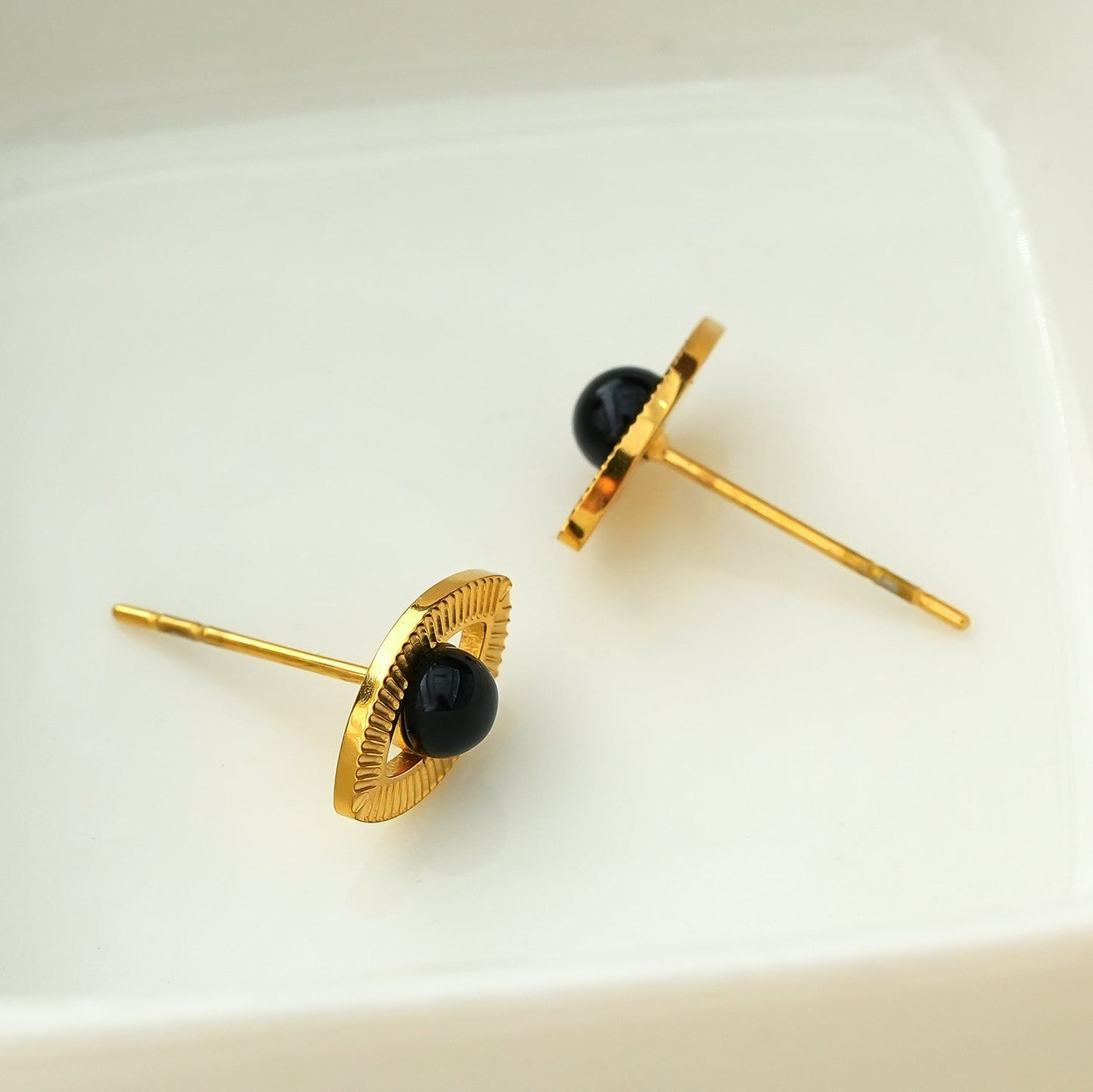 TAVIRA: Gold Evil Eye Studs with Black Onyx Embellishment